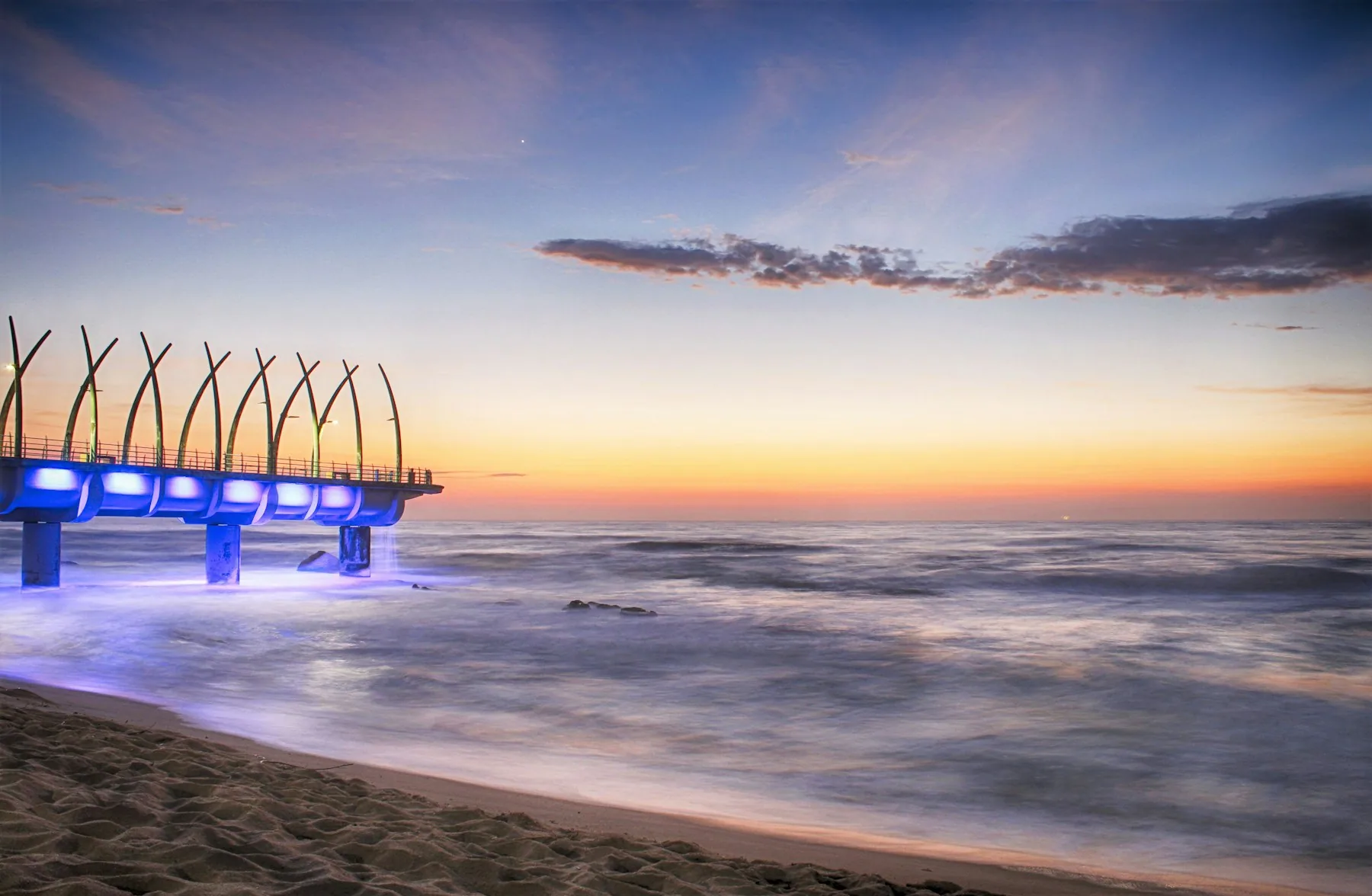 Pier and beach at sunset in Durban